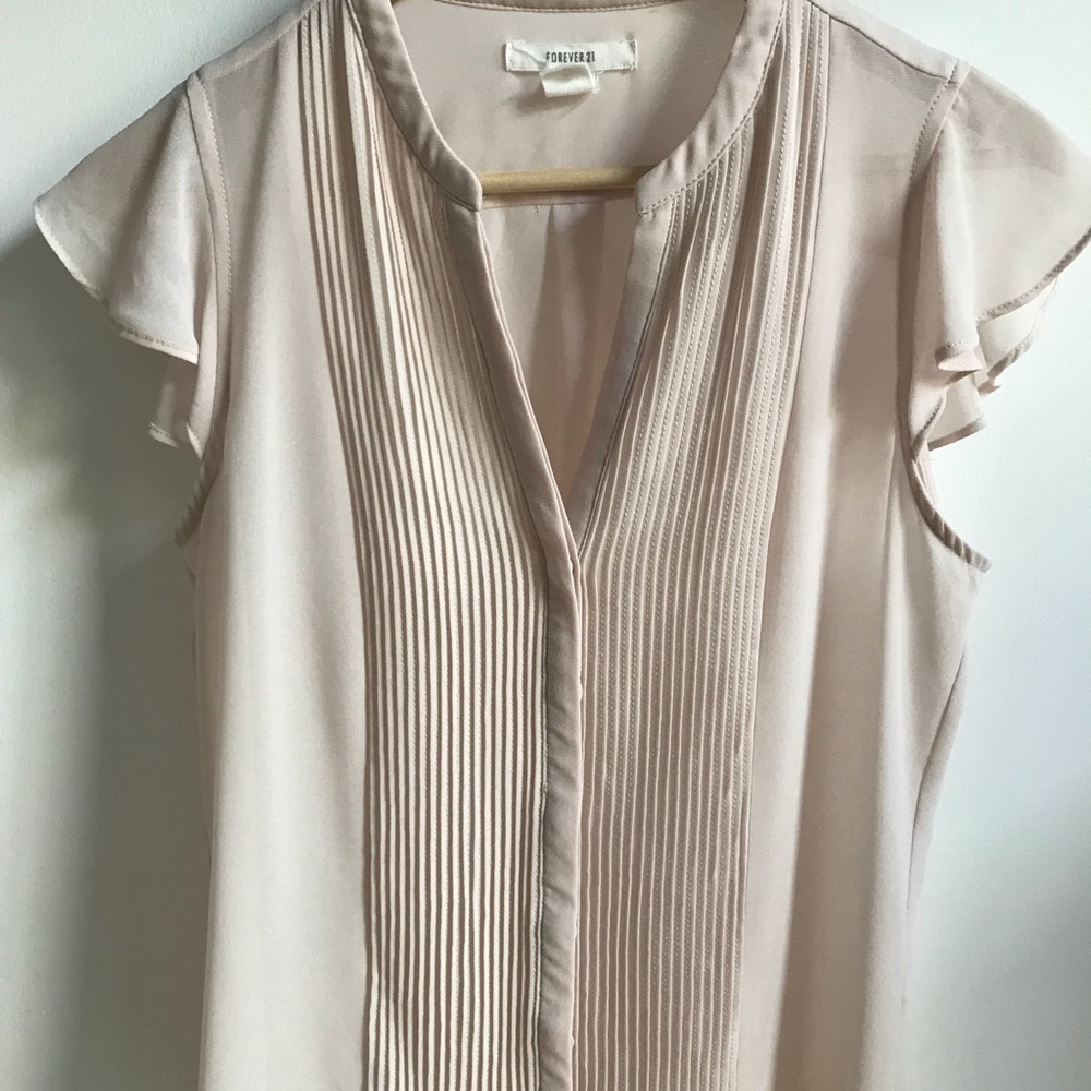 Cream blouse with ruffled sleeves